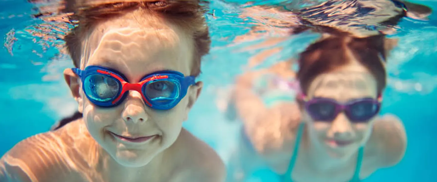 boys swimming underwater