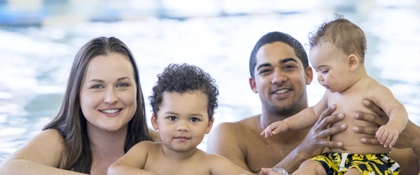family in swimming pool