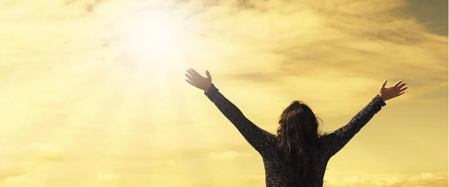 woman with arms to the sky