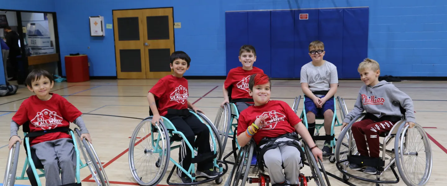 children in sports wheelchairs