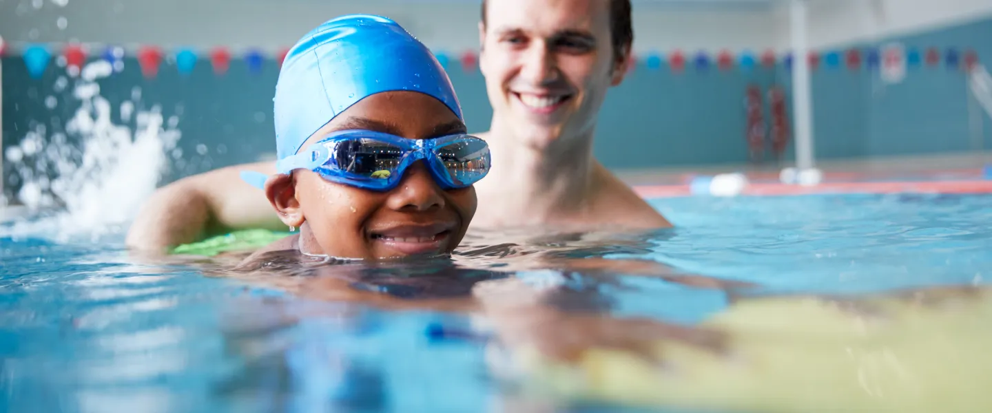 private swim lesson with student in pool