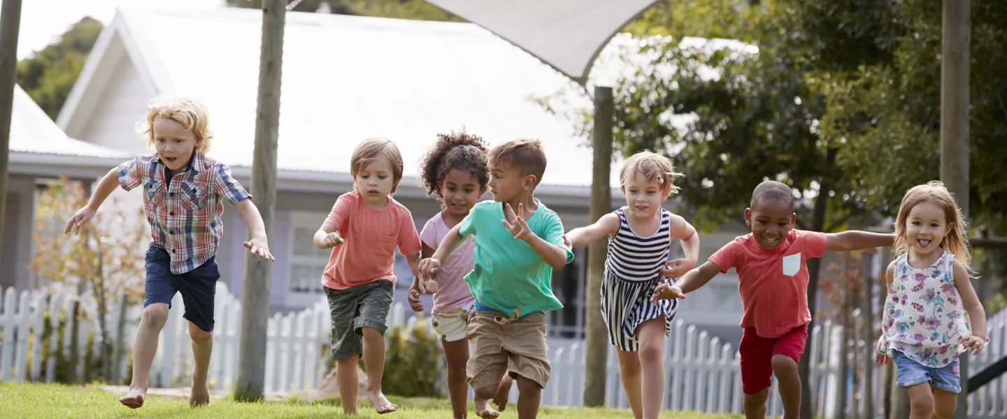 preschoolers running outdoors