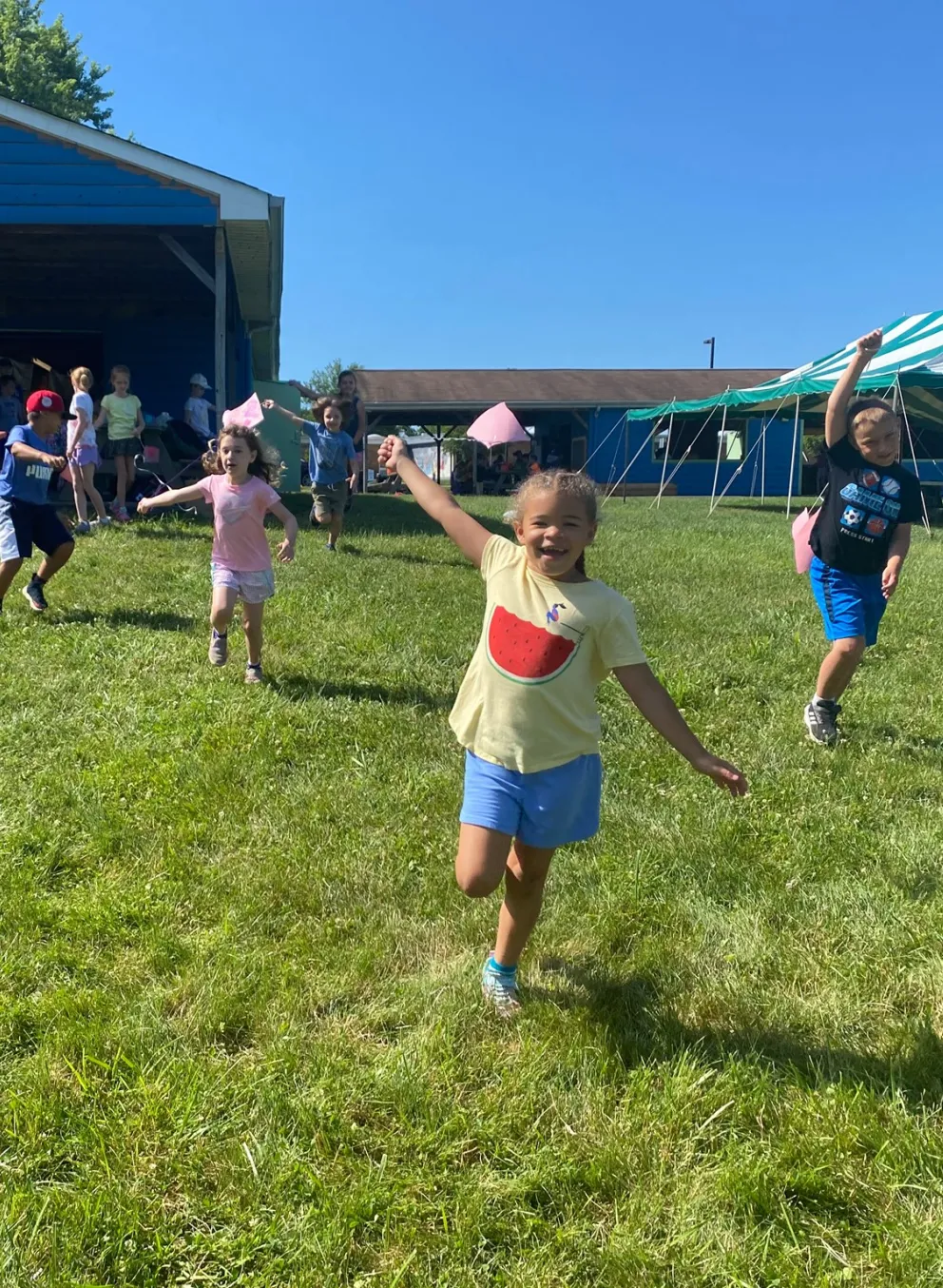 girl running down hill at summer camp