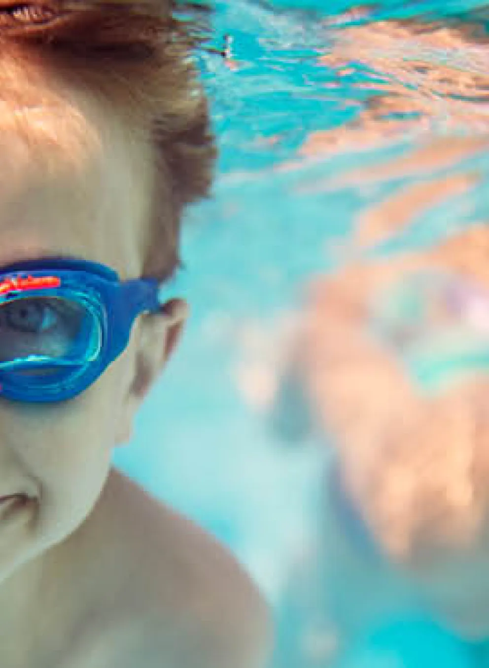 boys swimming underwater