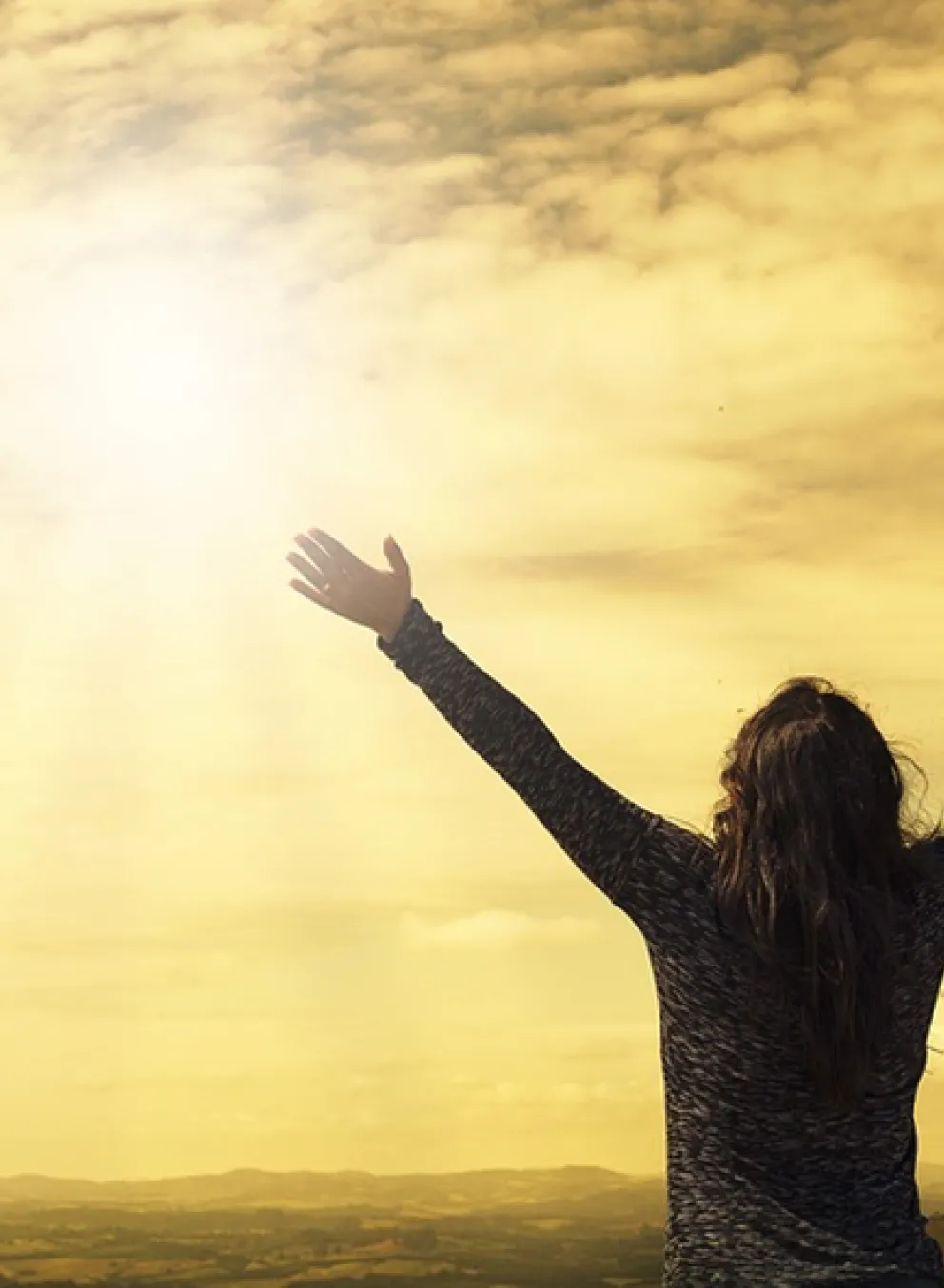 woman with arms to the sky