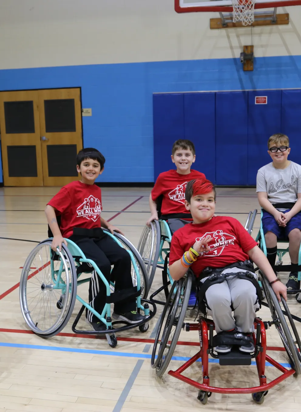 children in sports wheelchairs