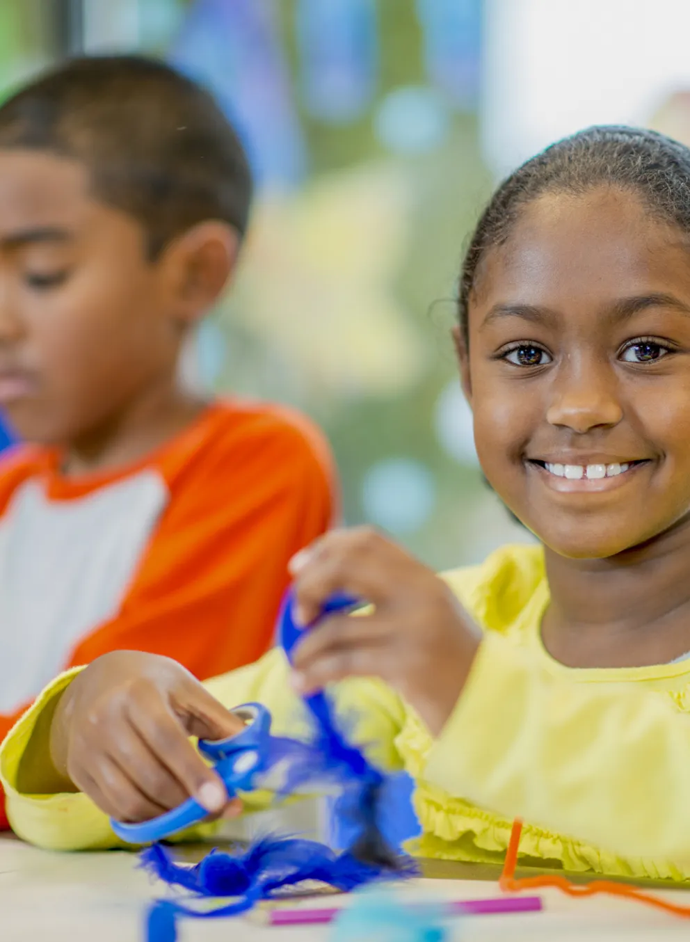 kids doing crafts at a table