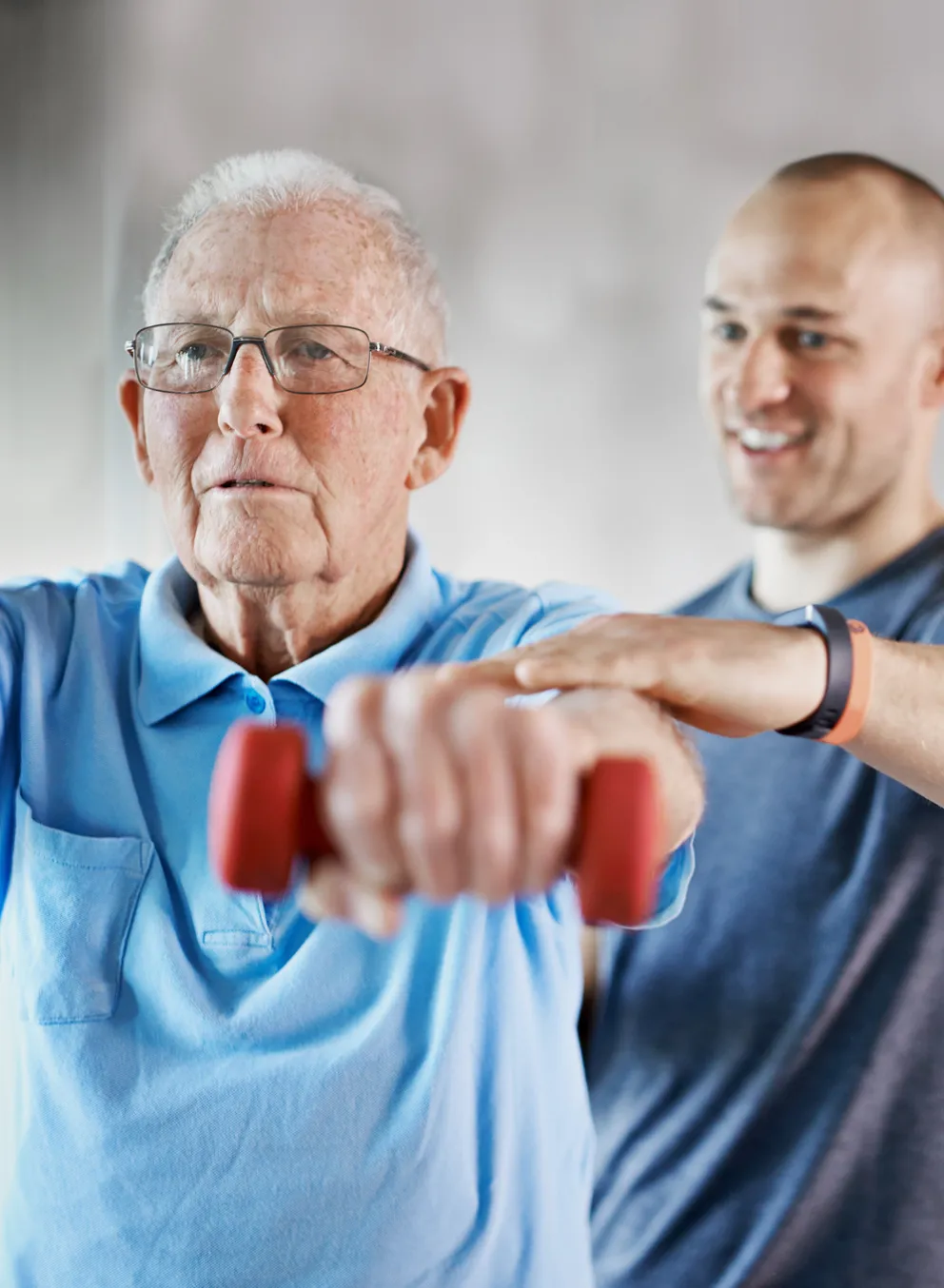 personal trainer with senior client
