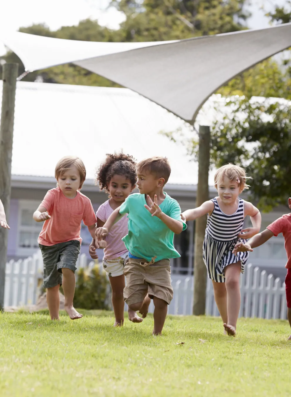 preschoolers running outdoors
