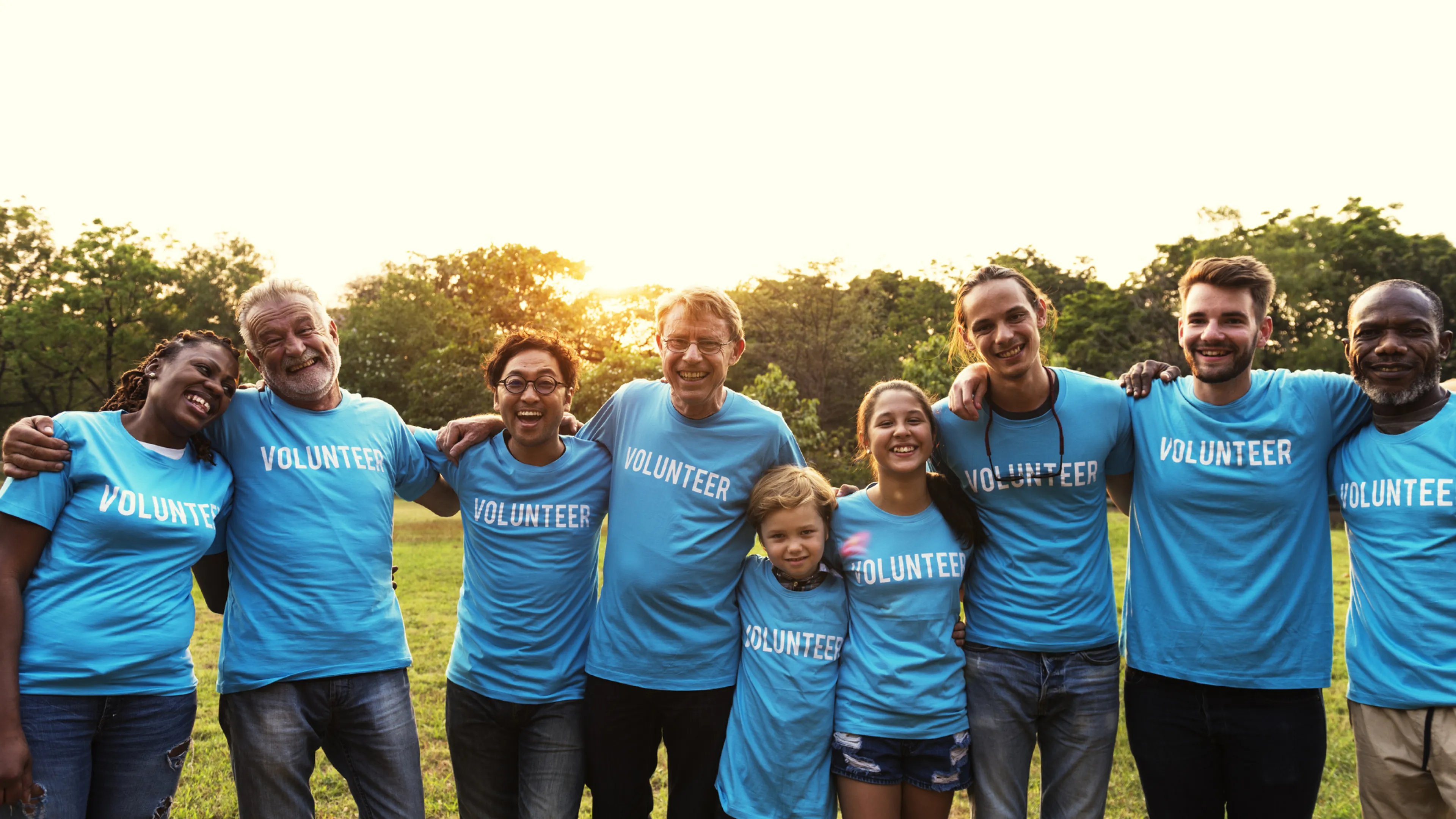 group of all ages wearing volunteer shirts