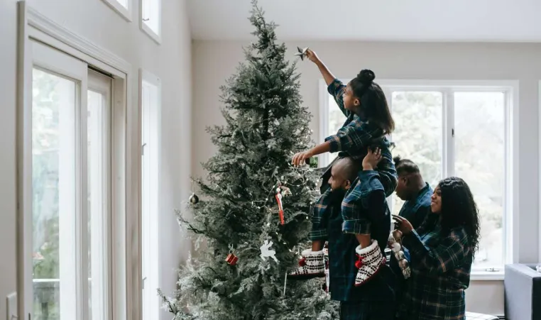 family at christmas tree