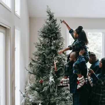 family at christmas tree