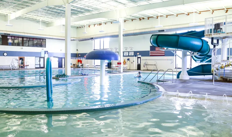 pool with water slide and play elements