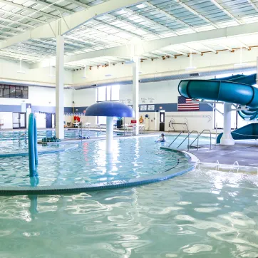 pool with water slide and play elements