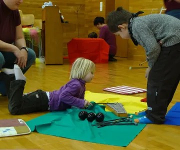 preschooler playing instrument