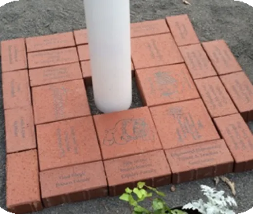 flagpole base at holland with monogramed bricks