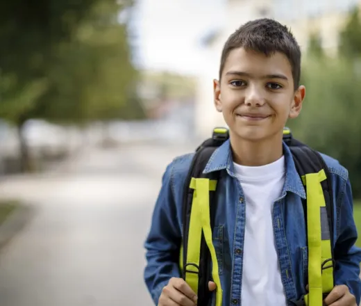 school age boy with backpack