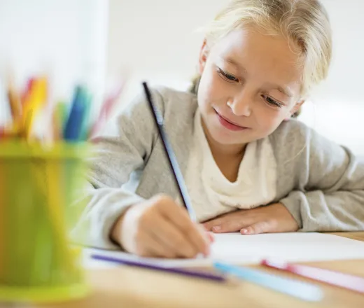 school age girl at desk