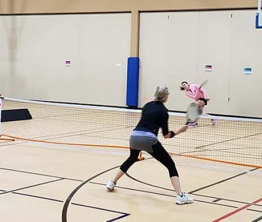 adults playing pickleball