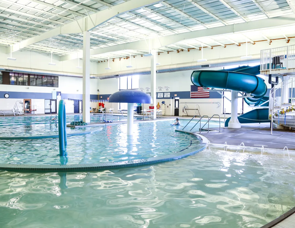 pool with water slide and play elements